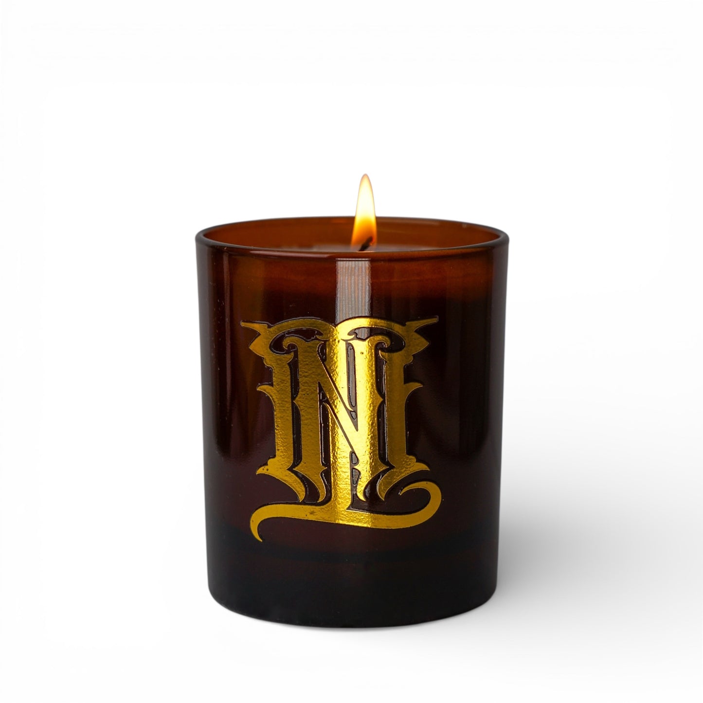 Brown candle with gold logo on a white background