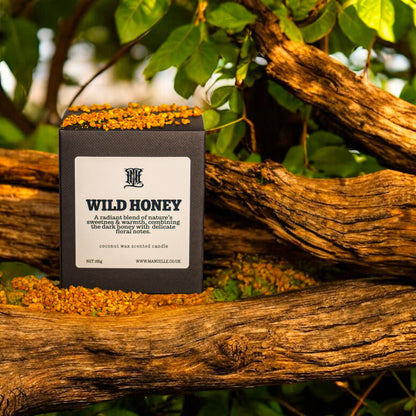 A CANDLE TEXTURED BOX NAMED 'WILD HONEY' ON A SANDALWOOD BRANCH
